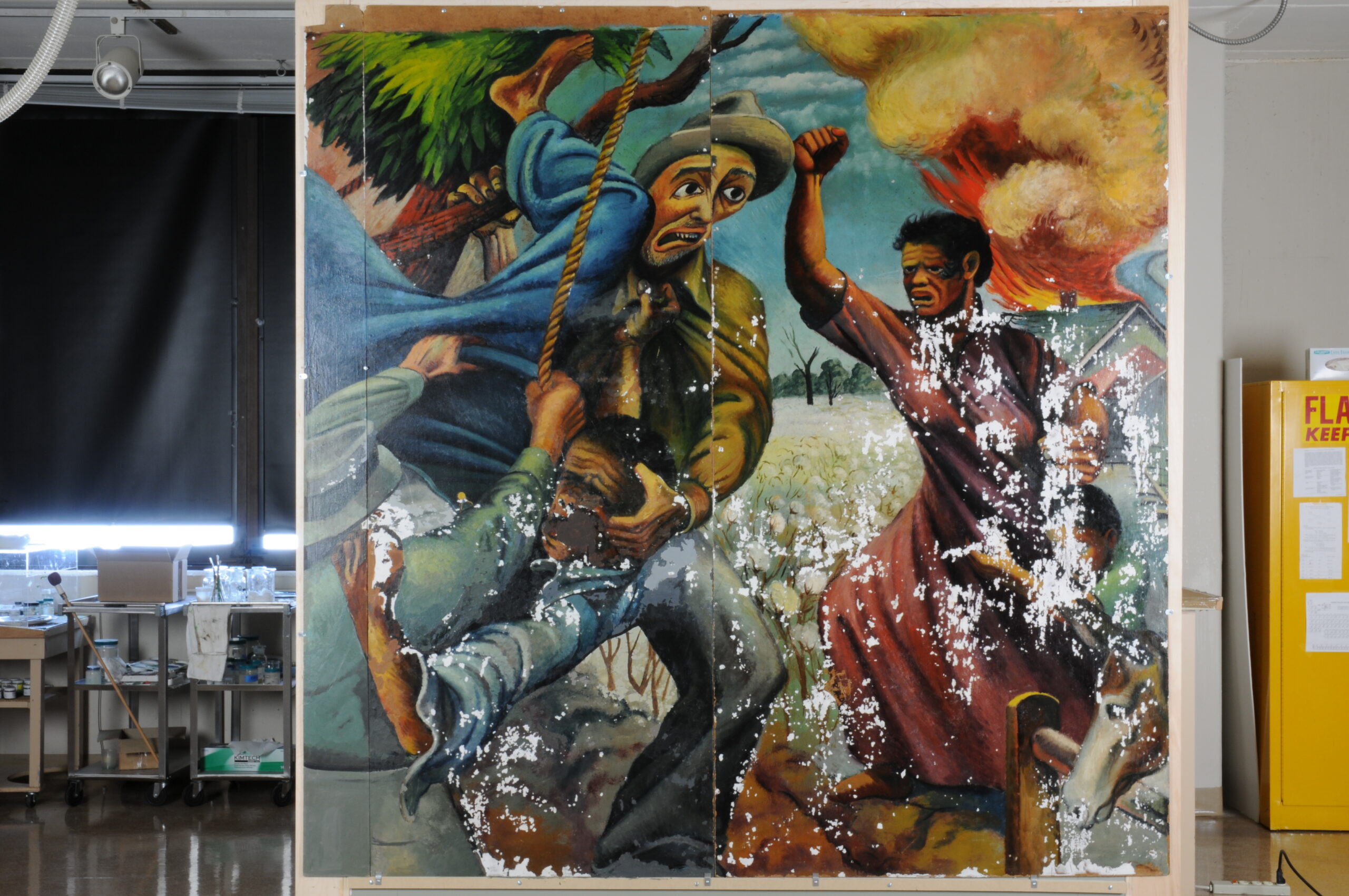 A painting depicting an attempted lynching. This photo was taken before conservation efforts, and the painting has large clusters where paint has flaked off.